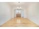 Elegant dining room with hardwood floors, wainscoting, and a classic chandelier, perfect for formal gatherings at 4355 Rainer Dr, Atlanta, GA 30349