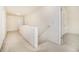 Upstairs hallway with neutral carpet, leading to various rooms at 4355 Rainer Dr, Atlanta, GA 30349