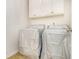 The laundry room features a washer and dryer and cabinets for storage at 4355 Rainer Dr, Atlanta, GA 30349