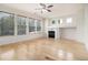 Bright living room featuring hardwood floors, a fireplace, and large windows providing ample natural light at 4355 Rainer Dr, Atlanta, GA 30349