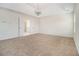Spacious bedroom featuring trey ceiling, carpet floors and access to the main bathroom at 4355 Rainer Dr, Atlanta, GA 30349
