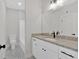 Bright bathroom featuring granite countertops, white cabinets, and black hardware at 4444 Sullivan Rd, Powder Springs, GA 30127