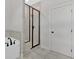 This bathroom has a stylish glass enclosed shower and soaking tub at 4444 Sullivan Rd, Powder Springs, GA 30127