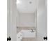 This bathroom has a white vanity and a luxurious soaking tub at 4444 Sullivan Rd, Powder Springs, GA 30127