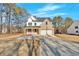 Beautiful two-story home with a long driveway, brick and white siding, and a two-car garage at 4444 Sullivan Rd, Powder Springs, GA 30127