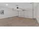 View of the spacious garage with door mechanism and plenty of room for parking and storage at 4444 Sullivan Rd, Powder Springs, GA 30127
