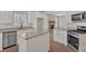 Bright kitchen featuring white cabinets, stainless appliances and an island at 4444 Sullivan Rd, Powder Springs, GA 30127