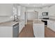 Modern kitchen featuring white cabinets, stainless appliances, granite countertops and a kitchen island at 4444 Sullivan Rd, Powder Springs, GA 30127