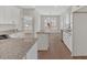 Modern kitchen featuring white cabinets, granite countertops and stainless steel appliances at 4444 Sullivan Rd, Powder Springs, GA 30127