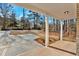 Covered brick porch with white columns offering views of the driveway and front yard at 4444 Sullivan Rd, Powder Springs, GA 30127