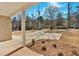 Exterior view of a covered brick porch with white columns, landscaping, and driveway at 4444 Sullivan Rd, Powder Springs, GA 30127