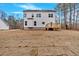 Rear exterior view of a two story home featuring a wooden deck and a spacious backyard with new sod at 4444 Sullivan Rd, Powder Springs, GA 30127
