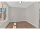 Bright room with hardwood floors and large windows showcasing natural light at 4444 Sullivan Rd, Powder Springs, GA 30127