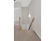 This staircase has wooden rails and a modern lighting fixture at 4444 Sullivan Rd, Powder Springs, GA 30127