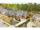 Beautiful aerial view of a red brick home with lush landscaping and a circular driveway at 145 Cuthbert Ln, Acworth, GA 30101