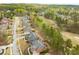 An aerial shot displays a beautiful neighborhood nestled around a golf course at 145 Cuthbert Ln, Acworth, GA 30101