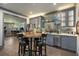 Entertainment area featuring a bar with hardwood floors, comfortable bar seating, and ample storage at 145 Cuthbert Ln, Acworth, GA 30101