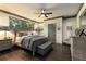 Cozy bedroom featuring a king-sized bed, neutral color palette, and decorative trim at 145 Cuthbert Ln, Acworth, GA 30101