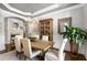 Dining room with fireplace, chandelier, and large cabinet, perfect for entertaining at 145 Cuthbert Ln, Acworth, GA 30101