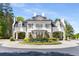 An elegant entrance to the Governors Towne Club features stunning architecture and vibrant landscaping at 145 Cuthbert Ln, Acworth, GA 30101