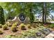 An impressive entrance to the Governors Towne Club with beautiful landscaping at 145 Cuthbert Ln, Acworth, GA 30101