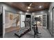 Private home gym featuring a wood plank ceiling and mirrored doors leading to other areas at 145 Cuthbert Ln, Acworth, GA 30101