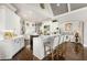Open-concept kitchen with white cabinets, granite counters, and a breakfast bar with seating at 145 Cuthbert Ln, Acworth, GA 30101