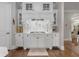 Chef's kitchen featuring custom cabinets, marble backsplash, and a pot filler faucet at 145 Cuthbert Ln, Acworth, GA 30101