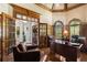 Sophisticated home office with wood paneling, hardwood floors, and ample natural light at 145 Cuthbert Ln, Acworth, GA 30101