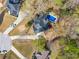 Aerial view of home with pool, backyard, driveway and landscaping at 2121 Rock Court, Loganville, GA 30052
