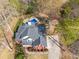 Aerial view of the home with a pool and a well-maintained backyard surrounded by trees at 2121 Rock Court, Loganville, GA 30052
