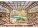 Backyard pergola swing set view to pool, deck, and yard on well-manicured grounds at 2121 Rock Court, Loganville, GA 30052