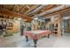Spacious basement featuring a pool table and exposed ductwork, ready for customization at 2121 Rock Court, Loganville, GA 30052