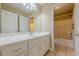 Well-lit bathroom with white cabinetry, tile flooring, and a shower/tub combo at 2121 Rock Court, Loganville, GA 30052