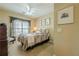 Cozy bedroom with a ceiling fan, window with curtains, and neutral decor at 2121 Rock Court, Loganville, GA 30052