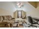 Bonus room featuring comfortable seating, desk, carpet, ceiling fan, and natural lighting at 2121 Rock Court, Loganville, GA 30052