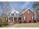 Beautiful two-story brick home with white trim and a landscaped front yard at 2121 Rock Court, Loganville, GA 30052