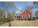 Beautiful two-story brick home showcasing a well-maintained lawn and lovely landscaping at 2121 Rock Court, Loganville, GA 30052