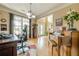Bright home office featuring hardwood floors, large windows, piano and built in desk at 2121 Rock Court, Loganville, GA 30052