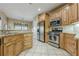 Well-appointed kitchen featuring granite countertops, stainless steel appliances, and custom cabinetry at 2121 Rock Court, Loganville, GA 30052