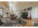 Spacious living room features hardwood floors, tall ceilings, a fireplace, and an open staircase at 2121 Rock Court, Loganville, GA 30052