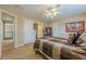 Spacious bedroom with neutral walls, carpet flooring, and a view of the hallway and bathroom at 2121 Rock Court, Loganville, GA 30052