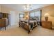 Comfortable bedroom with neutral walls, carpet flooring, and a ceiling fan at 2121 Rock Court, Loganville, GA 30052