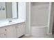 Bathroom showcasing a white vanity, sink, and a large soaking tub at 970 Sidney Marcus Ne Blvd # 2203, Atlanta, GA 30324