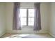 Cozy bedroom with carpet and neutral paint, paired with window and curtains at 970 Sidney Marcus Ne Blvd # 2203, Atlanta, GA 30324