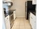 Compact kitchen with stainless steel appliances, tile backsplash, and ample cabinet space at 970 Sidney Marcus Ne Blvd # 2203, Atlanta, GA 30324