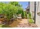 Private backyard retreat with charming seating area and lush landscaping at 165 2Nd St, Fayetteville, GA 30214