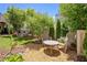 Relaxing backyard featuring outdoor seating, landscaping, and privacy fence at 165 2Nd St, Fayetteville, GA 30214