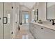 Bathroom with double vanity, soaking tub, and glass enclosed shower at 165 2Nd St, Fayetteville, GA 30214