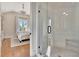 Bedroom leading to a bathroom with glass shower at 165 2Nd St, Fayetteville, GA 30214